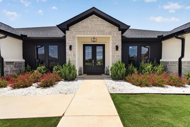 Welcome to this stunning 4-bedroom, 3-bathroom home in the gated - photo 3