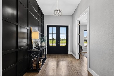 Welcome to this stunning 4-bedroom, 3-bathroom home in the gated - photo 5