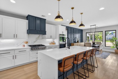 Welcome to this stunning 4-bedroom, 3-bathroom home in the gated - photo 8