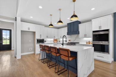 Welcome to this stunning 4-bedroom, 3-bathroom home in the gated - photo 9