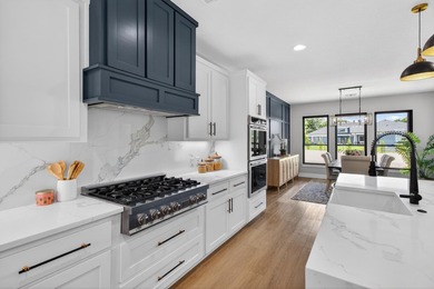 Welcome to this stunning 4-bedroom, 3-bathroom home in the gated - photo 10