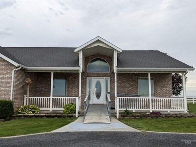 This well-maintained 3-bedroom, 2-bathroom brick home sits on 5