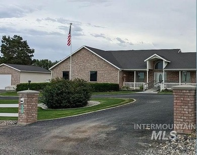 This well-maintained 3-bedroom, 2-bathroom brick home sits on 5