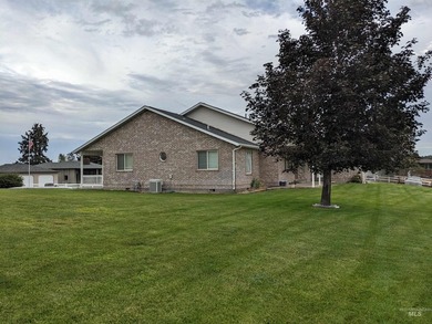 This well-maintained 3-bedroom, 2-bathroom brick home sits on 5