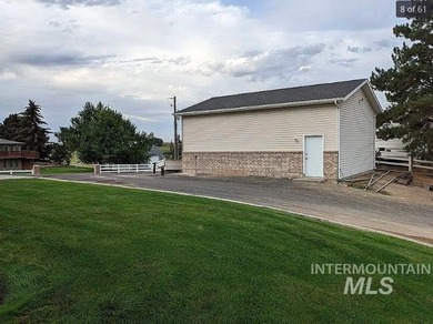 This well-maintained 3-bedroom, 2-bathroom brick home sits on 5