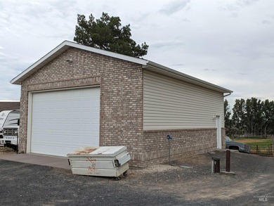 This well-maintained 3-bedroom, 2-bathroom brick home sits on 5