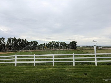 This well-maintained 3-bedroom, 2-bathroom brick home sits on 5