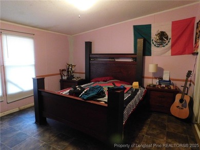 For Sale! This charming three-bedroom, two-bathroom home is