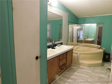 For Sale! This charming three-bedroom, two-bathroom home is