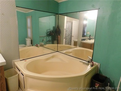 For Sale! This charming three-bedroom, two-bathroom home is