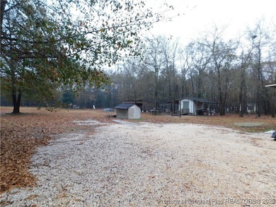 For Sale! This charming three-bedroom, two-bathroom home is
