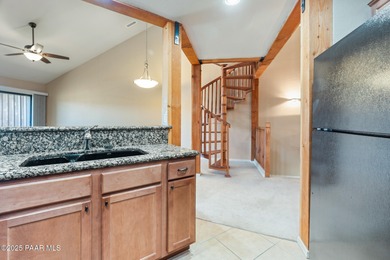 Tucked within the gated, pine-lined community of The Villages II