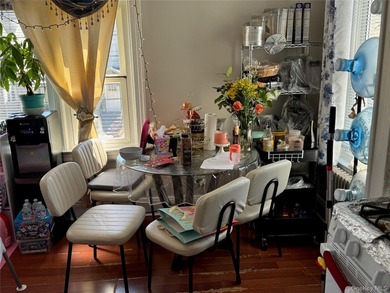 Welcome to a well-maintained two-family home offering - photo 5