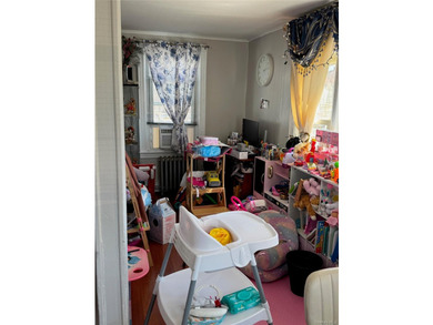 Welcome to a well-maintained two-family home offering - photo 6