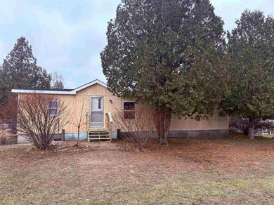 Lake Charlevoix Home For Sale in East Jordan Michigan