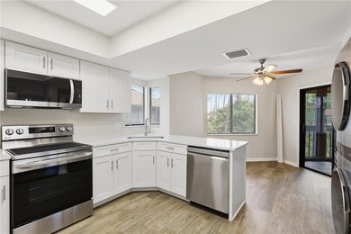 Welcome to this beautifully renovated second-floor condo in the - photo 14