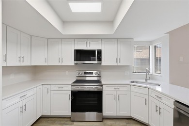 Welcome to this beautifully renovated second-floor condo in the - photo 15