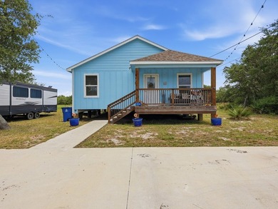 Built in 2021, this 3-bedroom, 2-bath coastal cottage sits on - photo 1