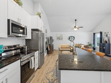 Built in 2021, this 3-bedroom, 2-bath coastal cottage sits on - photo 5