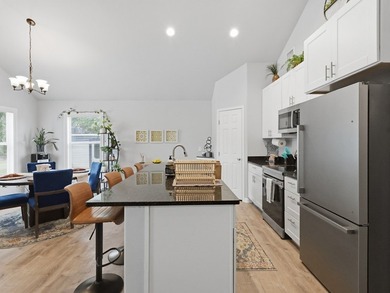 Built in 2021, this 3-bedroom, 2-bath coastal cottage sits on - photo 7