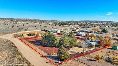 Set on a beautifully landscaped 0.8-acre lot in Paulden, AZ
