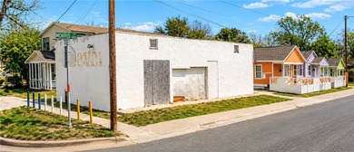 This versatile investment property features four buildings and - photo 3