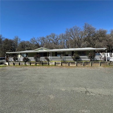 This property features a charming 3-bedroom, 2-bath manufactured - photo 3