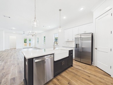 This spacious single-story residence offers a seamless blend of - photo 16