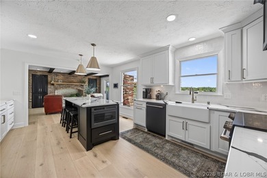 Classic brick ranch meets modern luxury in the heart of Osage - photo 23