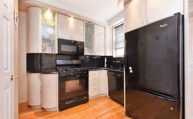 Located just minutes from Marine Park, this 1-family brick - photo 3