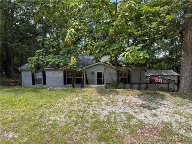 Lake Home ActiveUnderContr in Sunrise Beach, Missouri