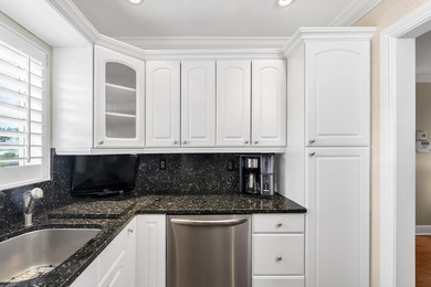 Welcome to this beautifully updated villa, featuring a spacious - photo 16