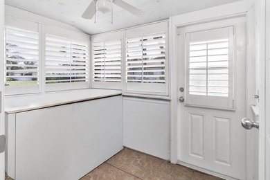 Welcome to this beautifully updated villa, featuring a spacious - photo 20