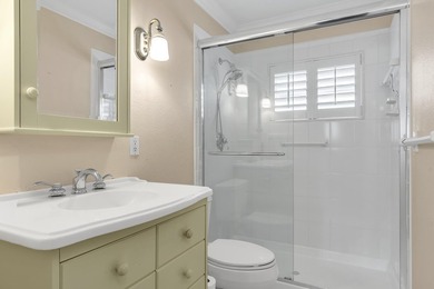 Welcome to this beautifully updated villa, featuring a spacious - photo 26