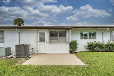 Welcome to this beautifully updated villa, featuring a spacious - photo 28