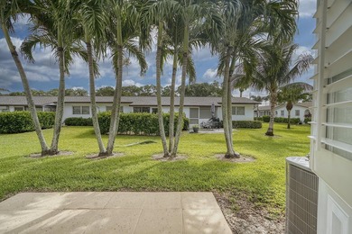 Welcome to this beautifully updated villa, featuring a spacious - photo 29
