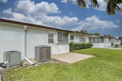 Welcome to this beautifully updated villa, featuring a spacious - photo 30