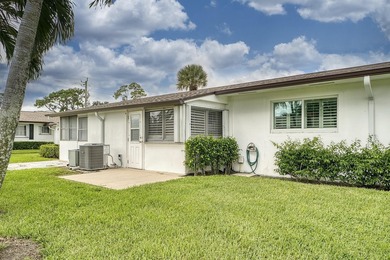 Welcome to this beautifully updated villa, featuring a spacious - photo 31