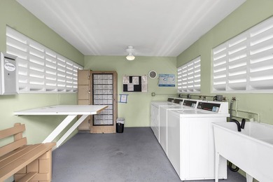 Welcome to this beautifully updated villa, featuring a spacious - photo 33