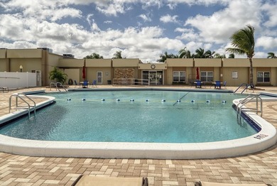 Welcome to this beautifully updated villa, featuring a spacious - photo 37