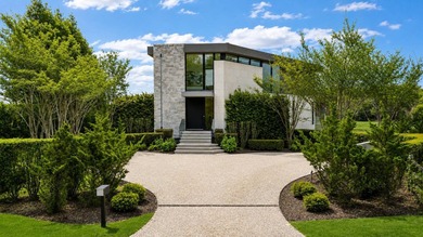 Perched along the pristine shoreline of Sag Harbor Bay, this - photo 3
