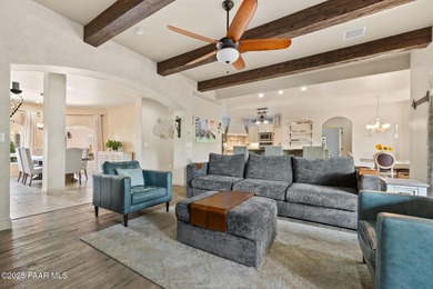 This charming 2013 single-level Tuscan Style custom residence in