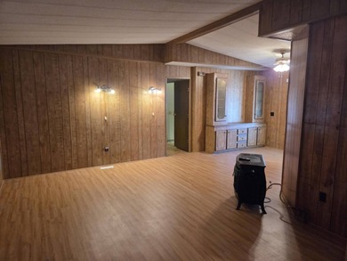 Discover this spacious 3-bedroom, 2-bathroom mobile home located