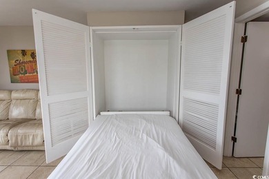 This cozy updated 1-bedroom, 1.5-bath oceanview end unit in