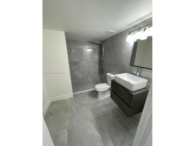 This completely remodeled 3-beds, 2-baths condo offers an