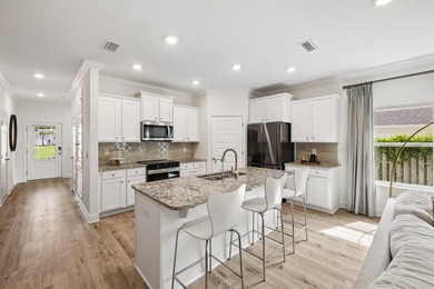 Located on a builder-designated premium lot in the more private - photo 11