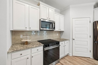 Located on a builder-designated premium lot in the more private - photo 12