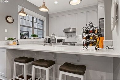 Modern, highly upgraded open-concept golf course condo with