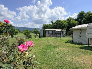 Charming 2BR/2BA home on .41 acres featuring owned solar panels - photo 33