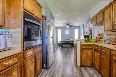 This spacious three-bedroom home features four-sided brick, a - photo 12